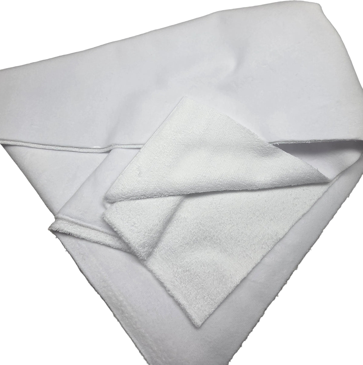 A folded white towel or cloth with a soft, plush texture, photographed on a neutral gray background.