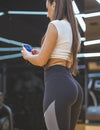 Why do girls wear yoga pants to the gym?