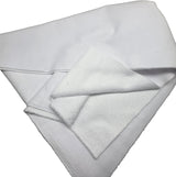A folded white towel or cloth with a soft, plush texture, photographed on a neutral gray background.